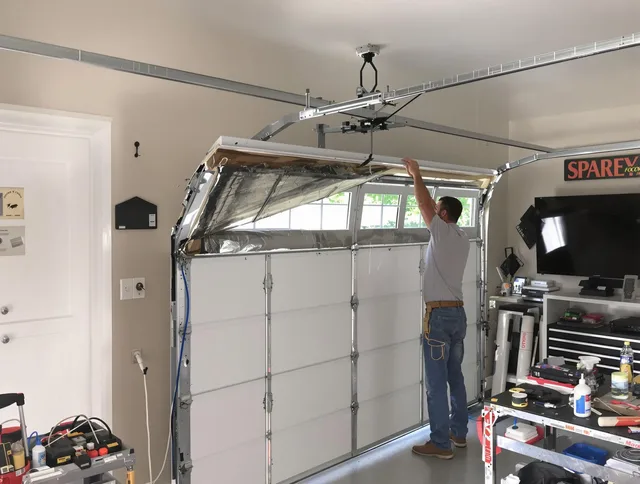 Garage door section replacement by Green Garage Door Repair in Green